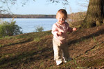 Jolie checking out a tiny little pine cone that she picked up.