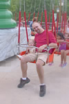 Jolie and Daddy on the swings at Dorney