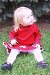 Jolie sitting in the grass at grandma's on a warm November day.