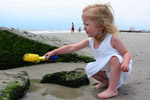 She loves playing in the sand.  Now every time we tell her were leaving to go somewhere, she often says "Going to the beach?"