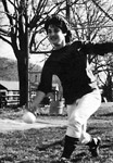 Kelly Clark, smiling while she pitches