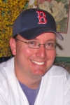 The smile of a man about to bid $1 on Jon Lieber and Ryan Madsen, and $2 on Endy Chavez.